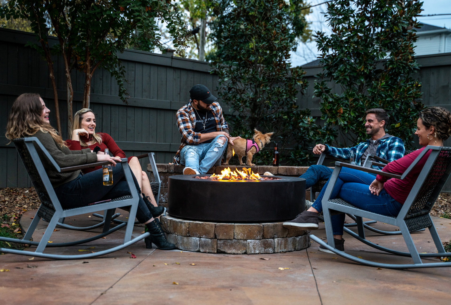 A group of friends around the fire pit