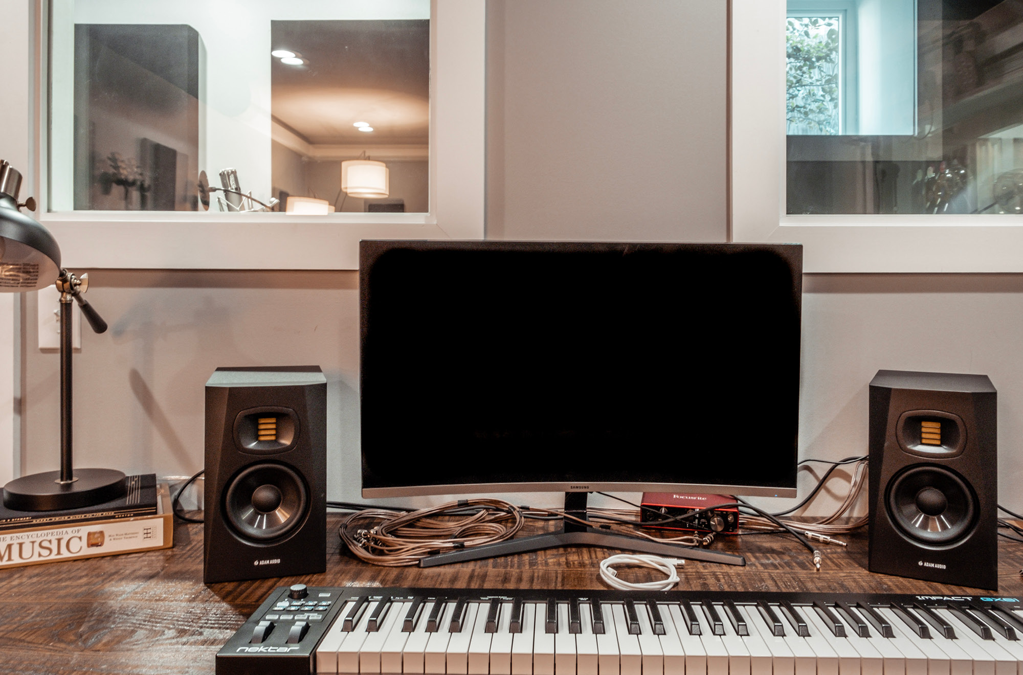 A keyboard, speakers and monitor in one of our writers rooms